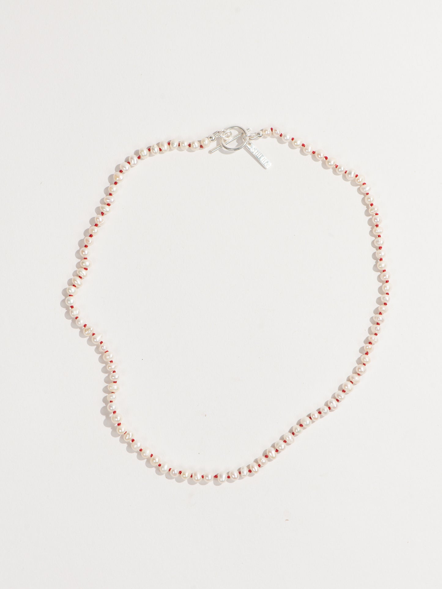 Knotted pearl necklace - Red