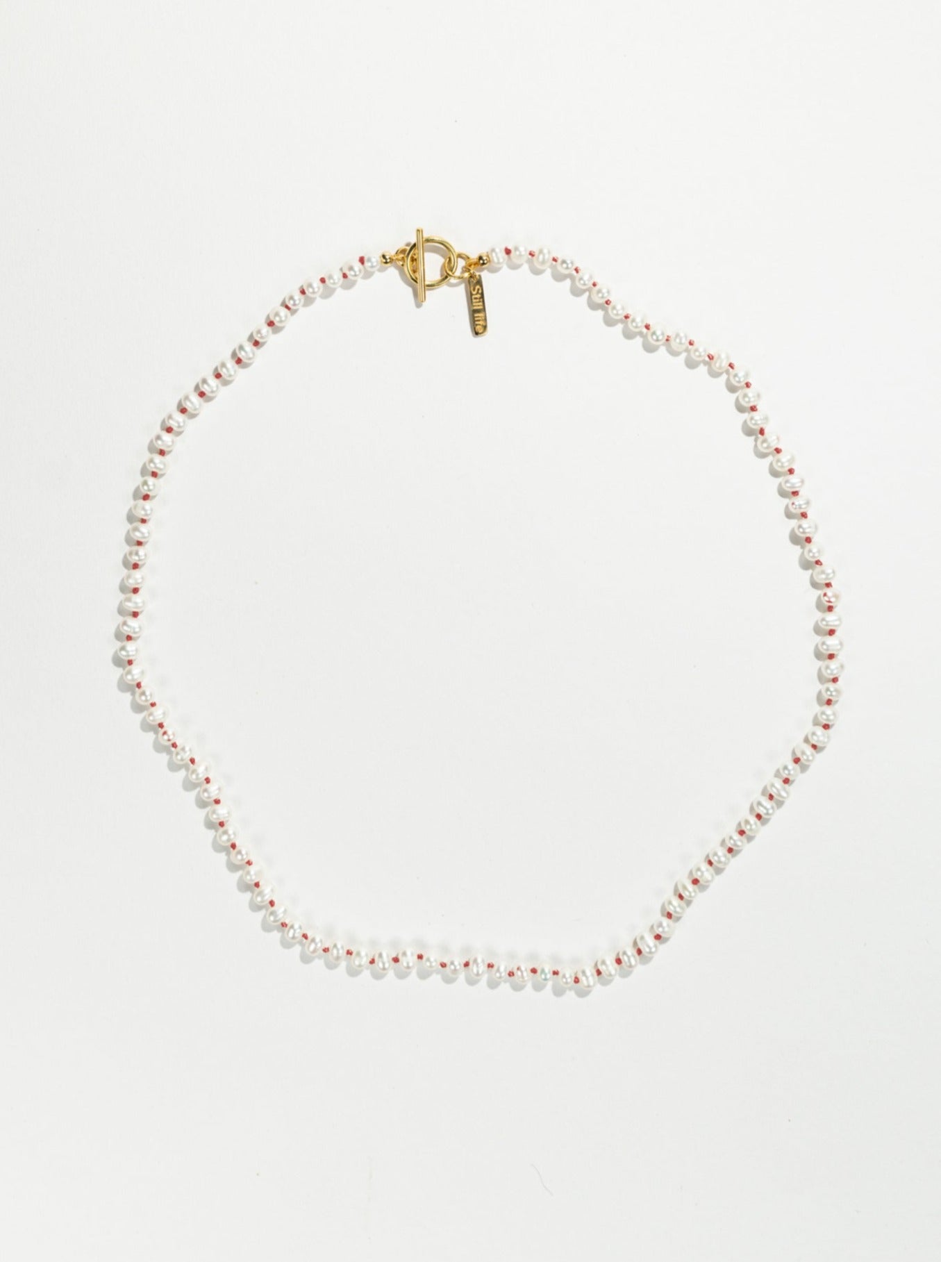 Knotted pearl necklace - Red Gold